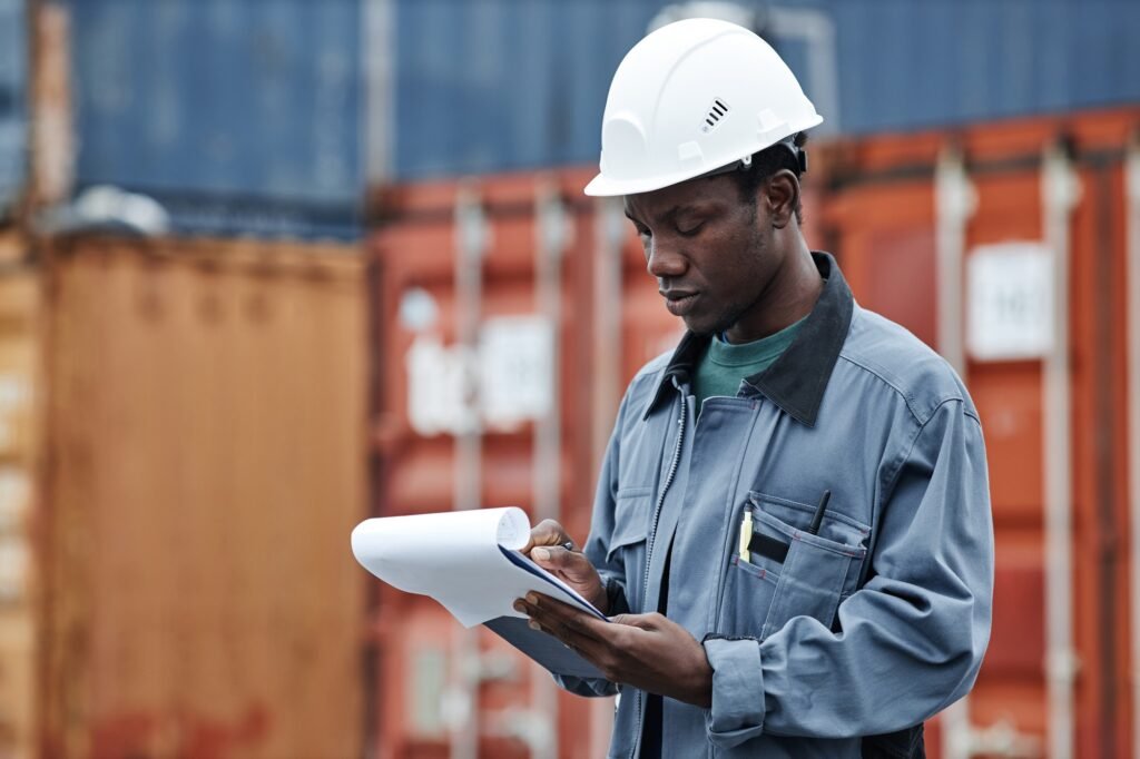 Black man working at shipping dock