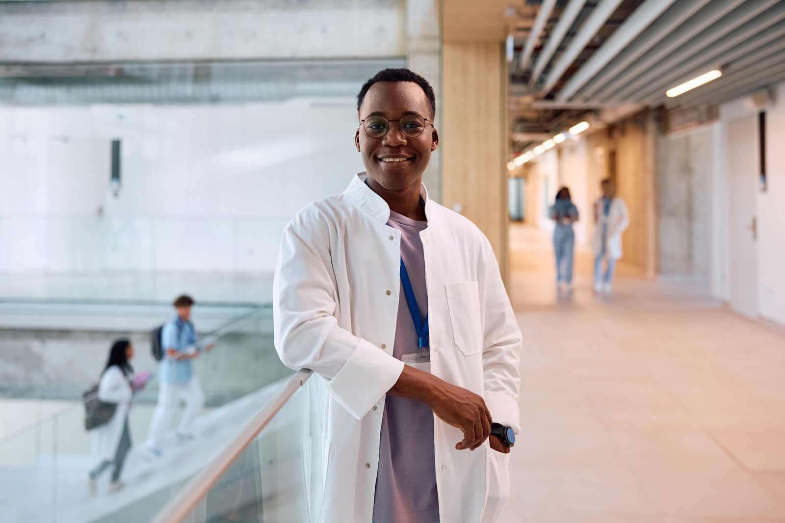 Portrait of happy black medical student looking at camera.